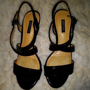 Black sequined, patent leather ladies heels. By Alex Marie size 6M.